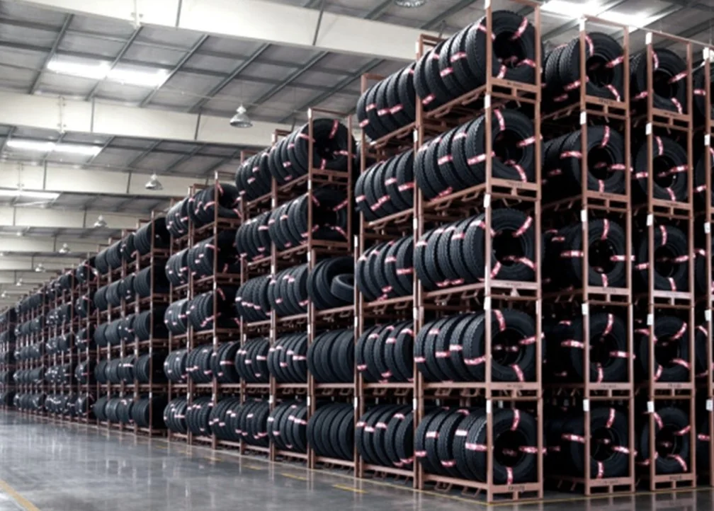 Finished tyres stacked inside a factory